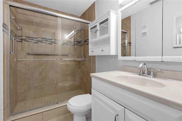 full bath with vanity, visible vents, toilet, and a stall shower