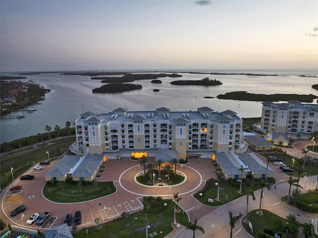 aerial view at dusk with a water view