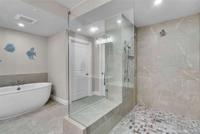 full bath with visible vents, recessed lighting, a walk in shower, and a freestanding bath