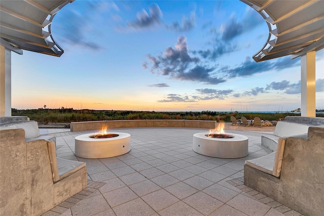 patio terrace at dusk with an outdoor fire pit
