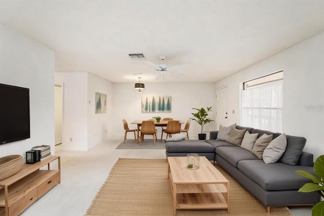 110 Hammock Pine Blvd Unit 110, Clearwater, FL 33761 - living room with light carpet and ceiling fan