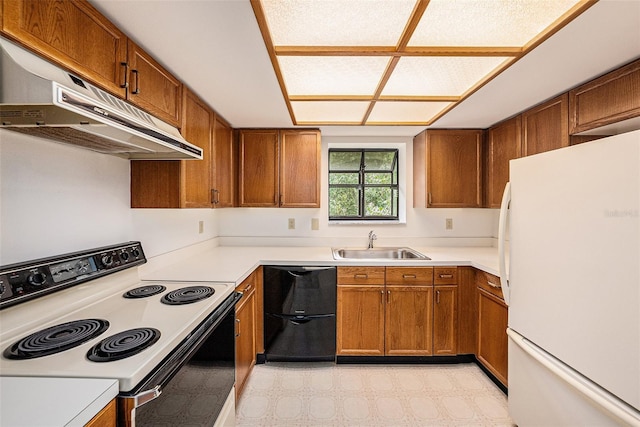 110 Hammock Pine Blvd Unit 110, Clearwater, FL 33761 - kitchen featuring range with electric stovetop, freestanding refrigerator, dishwashing machine, a sink, and brown cabinets