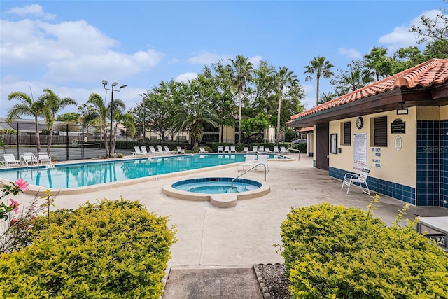110 Hammock Pine Blvd Unit 110, Clearwater, FL 33761 - community pool featuring a community hot tub and a patio