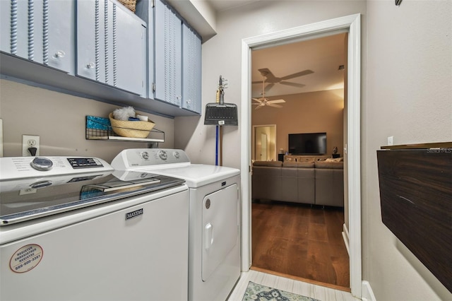 1187 Mistwood Dr, Tarpon Springs, FL 34688 - clothes washing area featuring a ceiling fan, cabinet space, wood finished floors, and washing machine and dryer