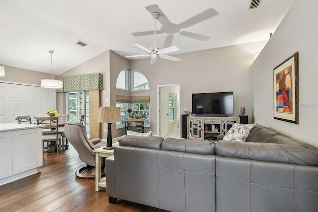 1187 Mistwood Dr, Tarpon Springs, FL 34688 - living area with vaulted ceiling, a ceiling fan, dark wood-style flooring, and visible vents