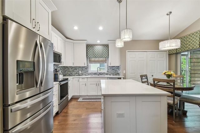 1187 Mistwood Dr, Tarpon Springs, FL 34688 - kitchen with tasteful backsplash, a sink, appliances with stainless steel finishes, light countertops, and dark wood-style flooring