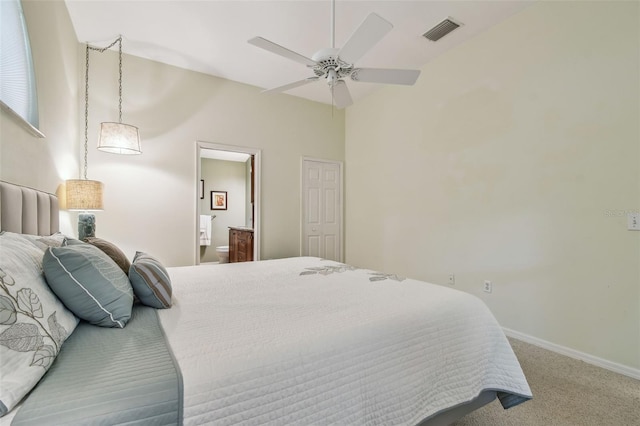 1187 Mistwood Dr, Tarpon Springs, FL 34688 - carpeted bedroom featuring ceiling fan, ensuite bath, visible vents, and baseboards
