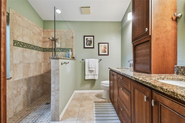 1187 Mistwood Dr, Tarpon Springs, FL 34688 - full bath featuring tile patterned floors, double vanity, toilet, a sink, and a walk in shower