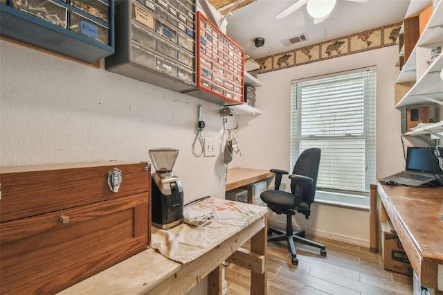 1187 Mistwood Dr, Tarpon Springs, FL 34688 - home office with wood finished floors, visible vents, baseboards, and ceiling fan