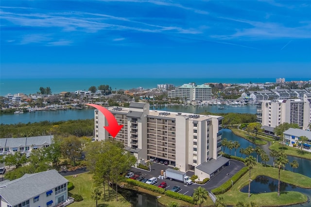 birds eye view of property featuring a water view