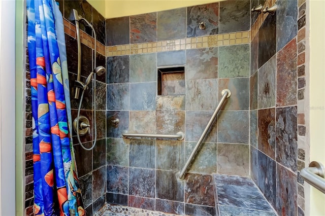 full bath featuring tiled shower