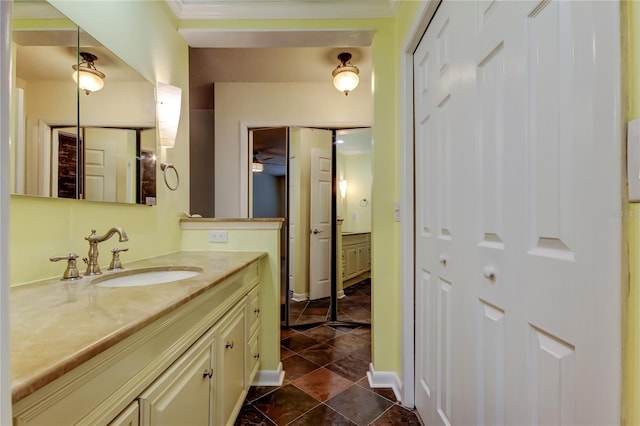 bathroom with a closet and vanity