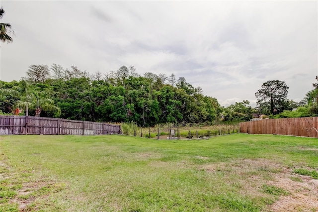 view of yard with fence