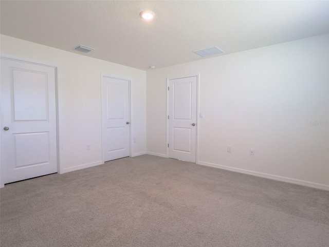 16805 Delia St, Wimauma, FL 33598 - unfurnished bedroom featuring baseboards, carpet flooring, and visible vents