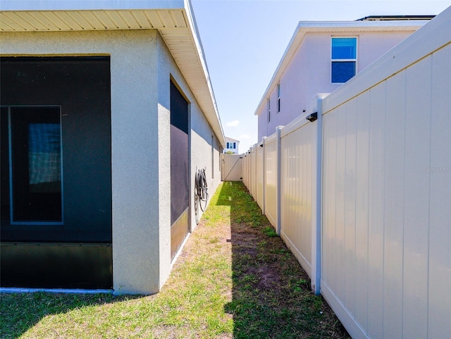 16805 Delia St, Wimauma, FL 33598 - view of home's exterior with stucco siding and fence