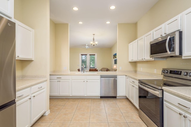 kitchen with a chandelier, recessed lighting, light tile patterned floors, appliances with stainless steel finishes, and a sink