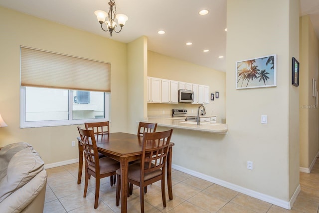 dining room with recessed lighting, light tile patterned floors, a notable chandelier, and baseboards