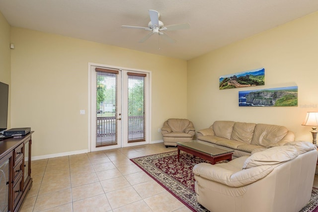 living room featuring french doors, light tile patterned floors, baseboards, and a ceiling fan