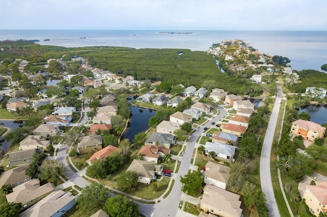 bird's eye view featuring a water view and a residential view