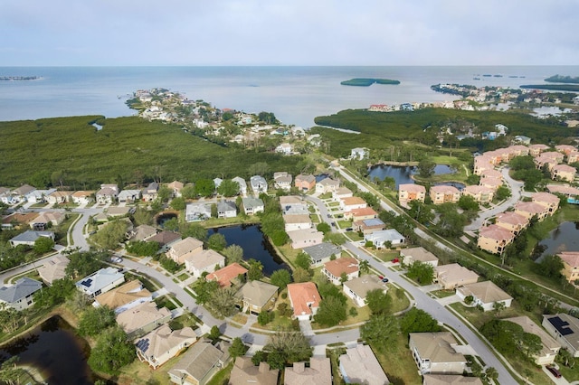 birds eye view of property with a residential view and a water view