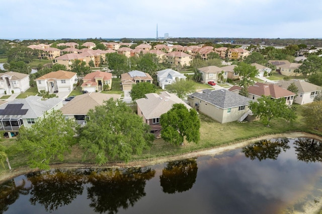birds eye view of property featuring a water view and a residential view