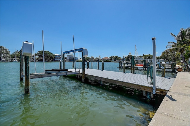 dock area with a water view and boat lift