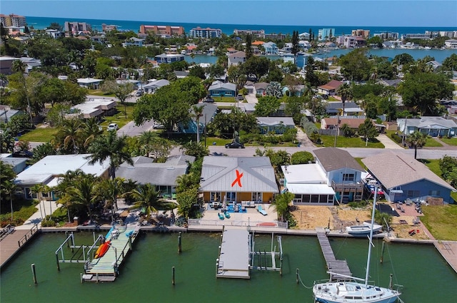 birds eye view of property featuring a residential view and a water view