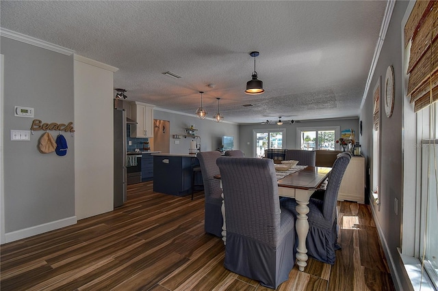 dining area featuring a textured ceiling, visible vents, baseboards, ornamental molding, and dark wood-type flooring