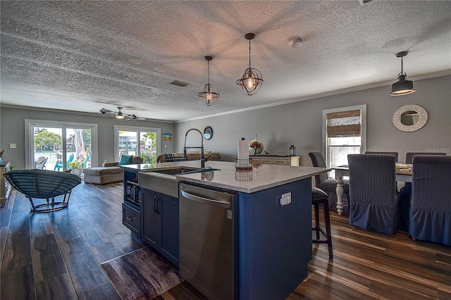 kitchen with stainless steel dishwasher, open floor plan, dark wood-style flooring, and blue cabinetry