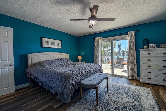 bedroom with wood finished floors, a textured ceiling, access to outside, baseboards, and ceiling fan