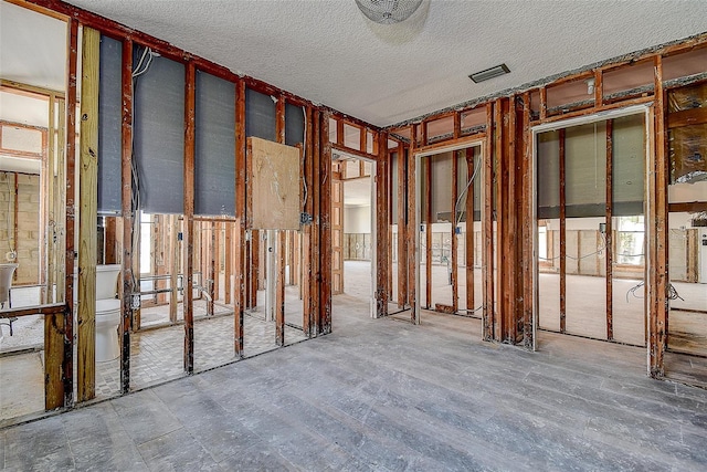 misc room with a textured ceiling and visible vents