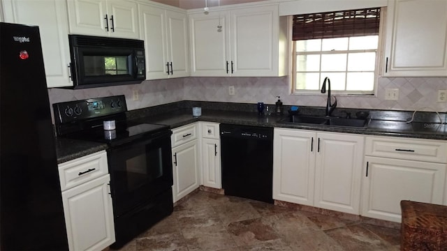 2101 Fox Chase Blvd Unit 102, Palm Harbor, FL 34683 - kitchen with black appliances, a sink, dark countertops, white cabinets, and tasteful backsplash