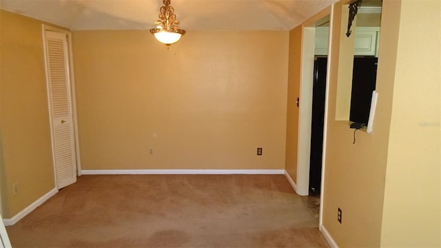 2101 Fox Chase Blvd Unit 102, Palm Harbor, FL 34683 - empty room featuring light colored carpet and baseboards