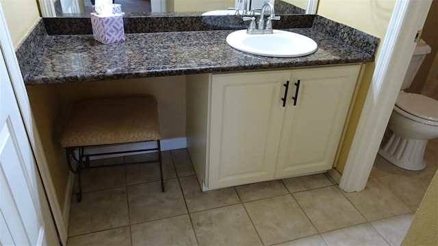2101 Fox Chase Blvd Unit 102, Palm Harbor, FL 34683 - bathroom with vanity, tile patterned flooring, and toilet