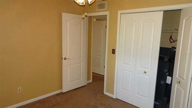 2101 Fox Chase Blvd Unit 102, Palm Harbor, FL 34683 - unfurnished bedroom with a closet, carpet floors, and baseboards