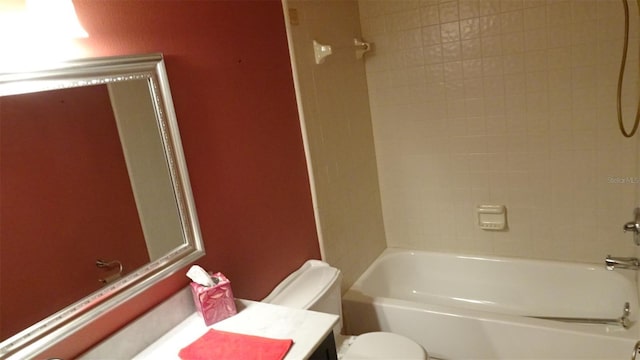 2101 Fox Chase Blvd Unit 102, Palm Harbor, FL 34683 - bathroom featuring toilet, vanity, and  shower combination