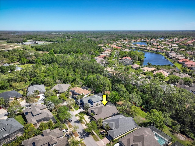 bird's eye view with a water view and a residential view