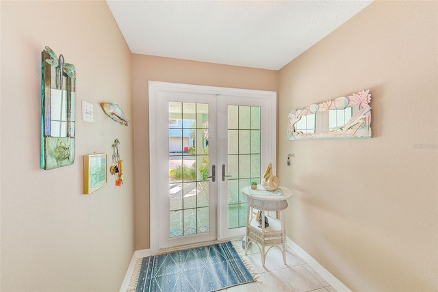 615 Garland Cir, Indian Rocks Beach, FL 33785 - entryway featuring baseboards, tile patterned floors, and french doors