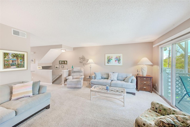 615 Garland Cir, Indian Rocks Beach, FL 33785 - living room featuring carpet, a textured ceiling, and baseboards