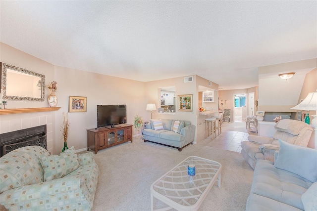 615 Garland Cir, Indian Rocks Beach, FL 33785 - carpeted living room featuring a fireplace and baseboards