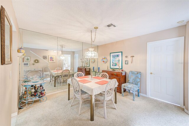 615 Garland Cir, Indian Rocks Beach, FL 33785 - dining room with light colored carpet and baseboards