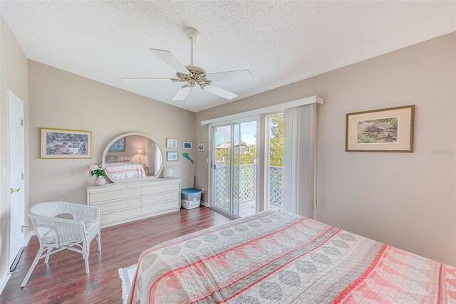 615 Garland Cir, Indian Rocks Beach, FL 33785 - bedroom featuring access to exterior, wood finished floors, a textured ceiling, baseboards, and ceiling fan