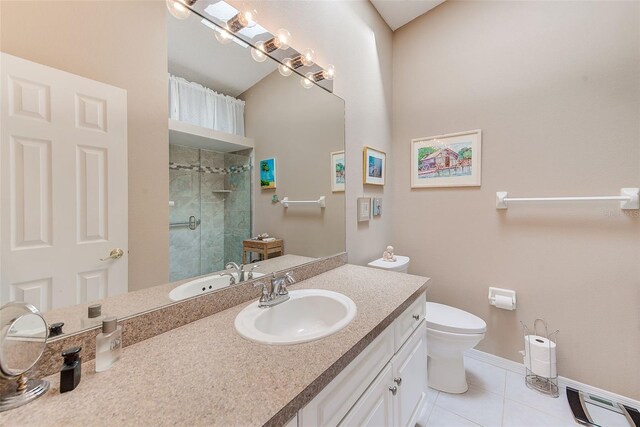 615 Garland Cir, Indian Rocks Beach, FL 33785 - full bathroom with a tile shower, tile patterned floors, vanity, toilet, and baseboards