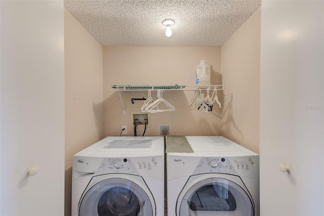 615 Garland Cir, Indian Rocks Beach, FL 33785 - washroom featuring independent washer and dryer and a textured ceiling