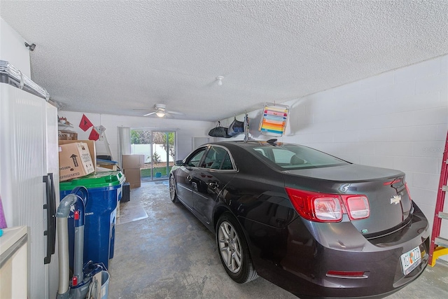 615 Garland Cir, Indian Rocks Beach, FL 33785 - garage with a ceiling fan, concrete block wall, and a garage door opener