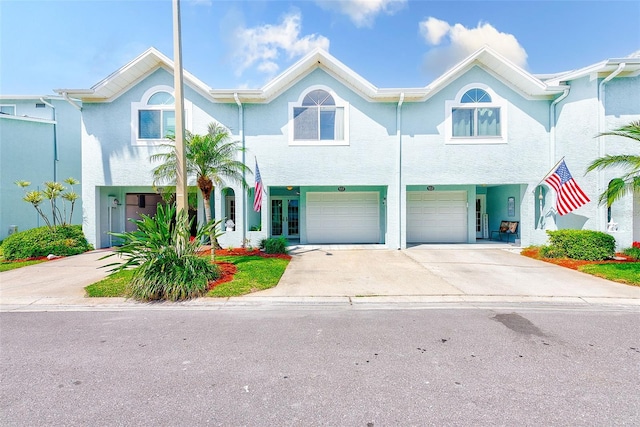 615 Garland Cir, Indian Rocks Beach, FL 33785 - view of property featuring driveway and an attached garage