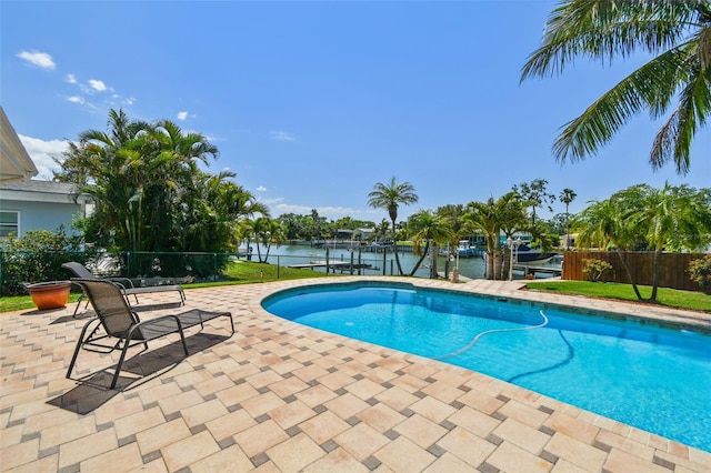 6667 28th St S, Saint Petersburg, FL 33712 - view of swimming pool with fence, a patio, a dock, a fenced in pool, and a water view
