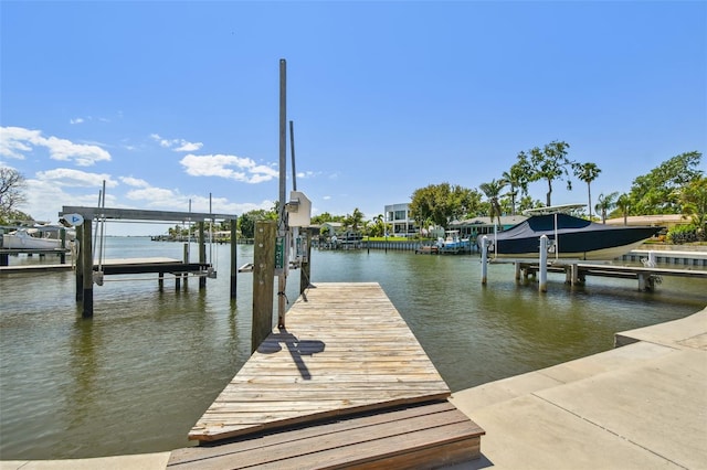 6667 28th St S, Saint Petersburg, FL 33712 - view of dock featuring boat lift and a water view
