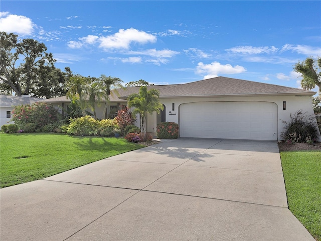 3323 Ringwood Mdw, Sarasota, FL 34235 - ranch-style home featuring a garage, driveway, a front yard, and stucco siding