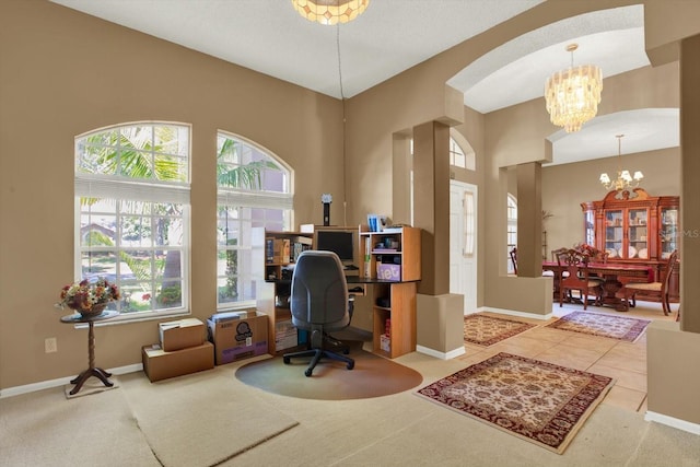 tiled home office with arched walkways, baseboards, and a chandelier